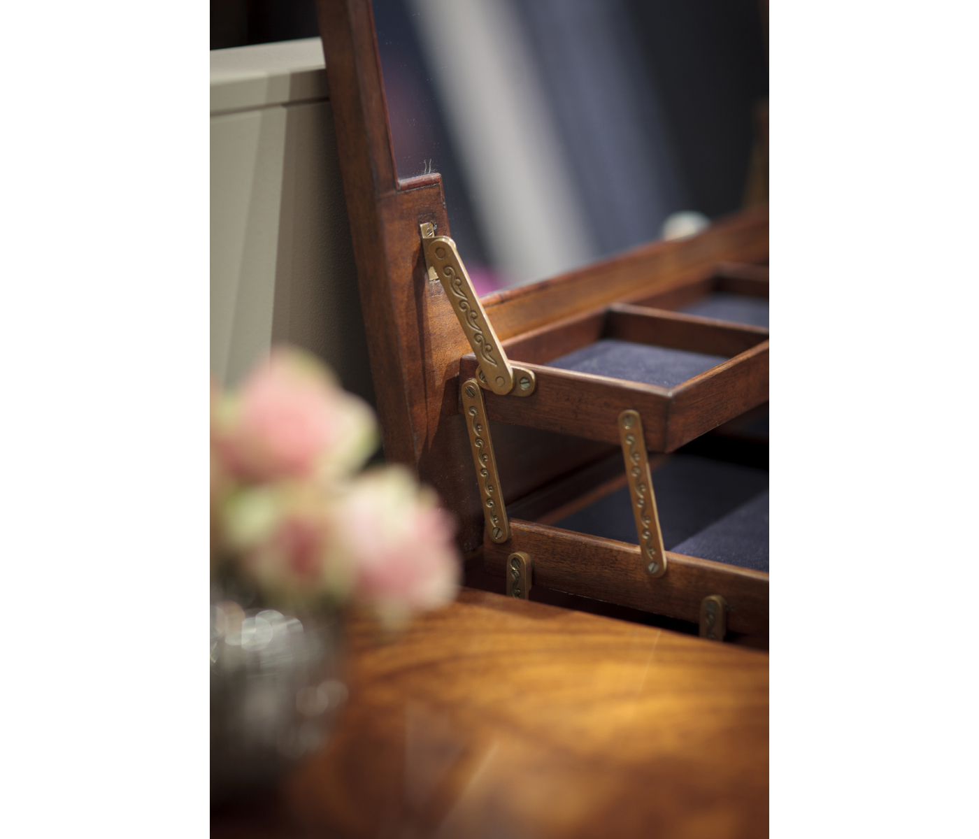 Dressing table with hinged mirror